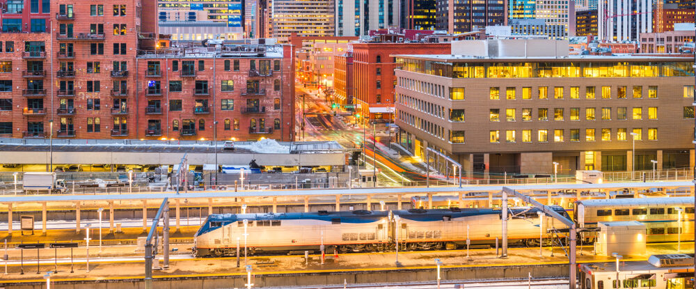 Denver, Colorado, USA downtown cityscape over the train station at twilight.