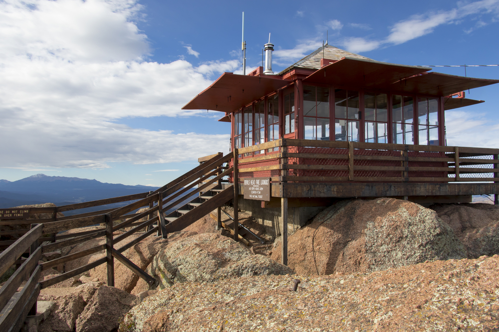 Colorado's Pike National Forest at Devil's Head Lookout - cabin used to look for forest fires. Pikes peak in background.