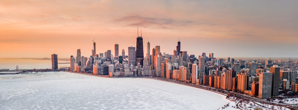 Aerial view of a frozen-over Lake Michigan and the Chicago skyline.