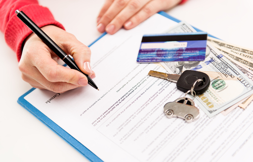 person signing rental car contract