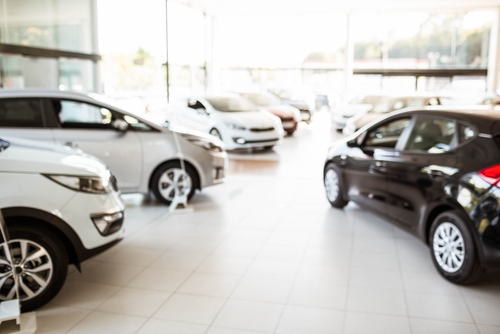 cars on showroom floor for car rental company