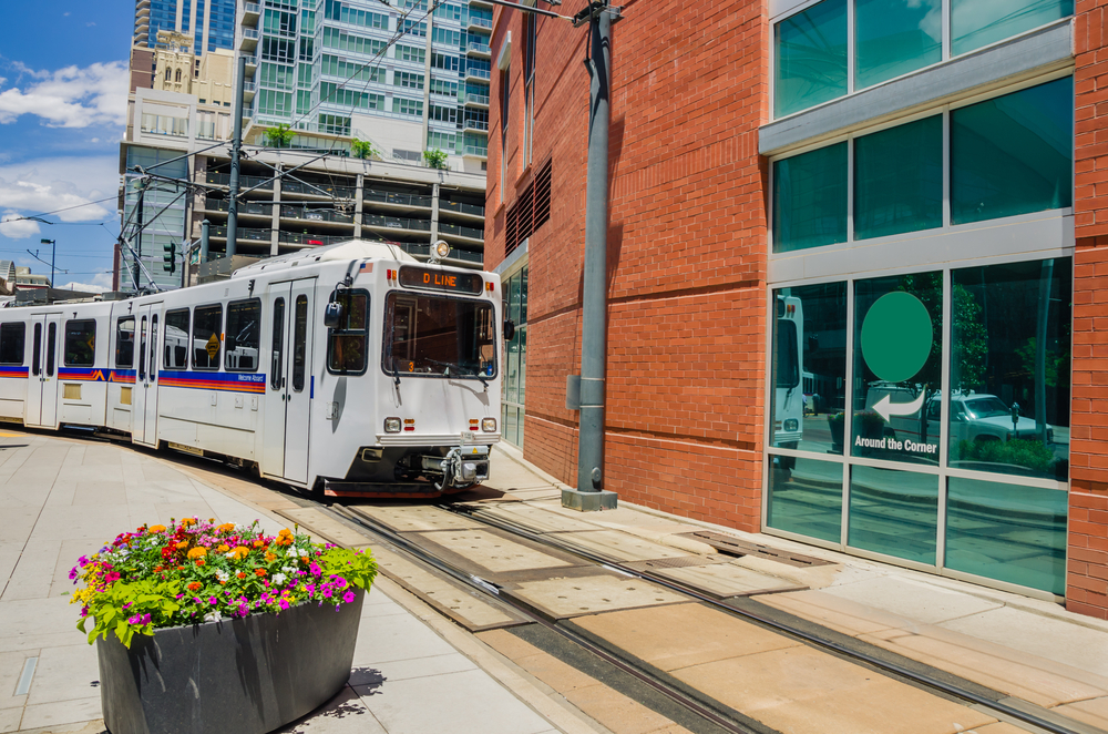 Light rail train pulls into a station in Denver