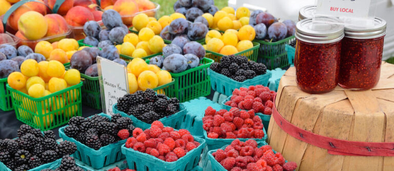 Berries and preserves at outdoor farmers market
